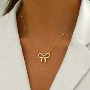 Gold bow necklace